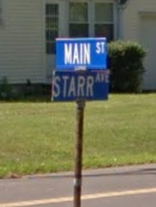 Photograph of street signs: Main Street and Starr Avenue
