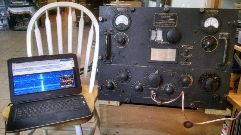 Photograph of laptop computer on chair to the immediate left of RAL-5 receiver on chair stand.