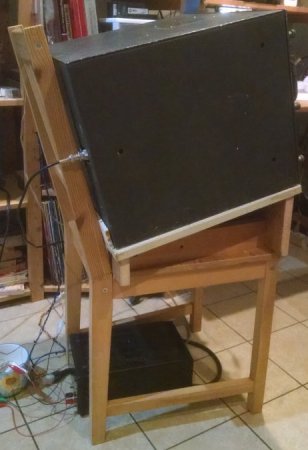 Left-side-view photograph of RAL-5 receiver on chair stand showing upward tilting of receiver front panel for better viewing and control.